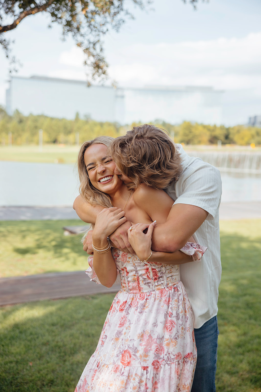 couple share an intimate moment together by the water