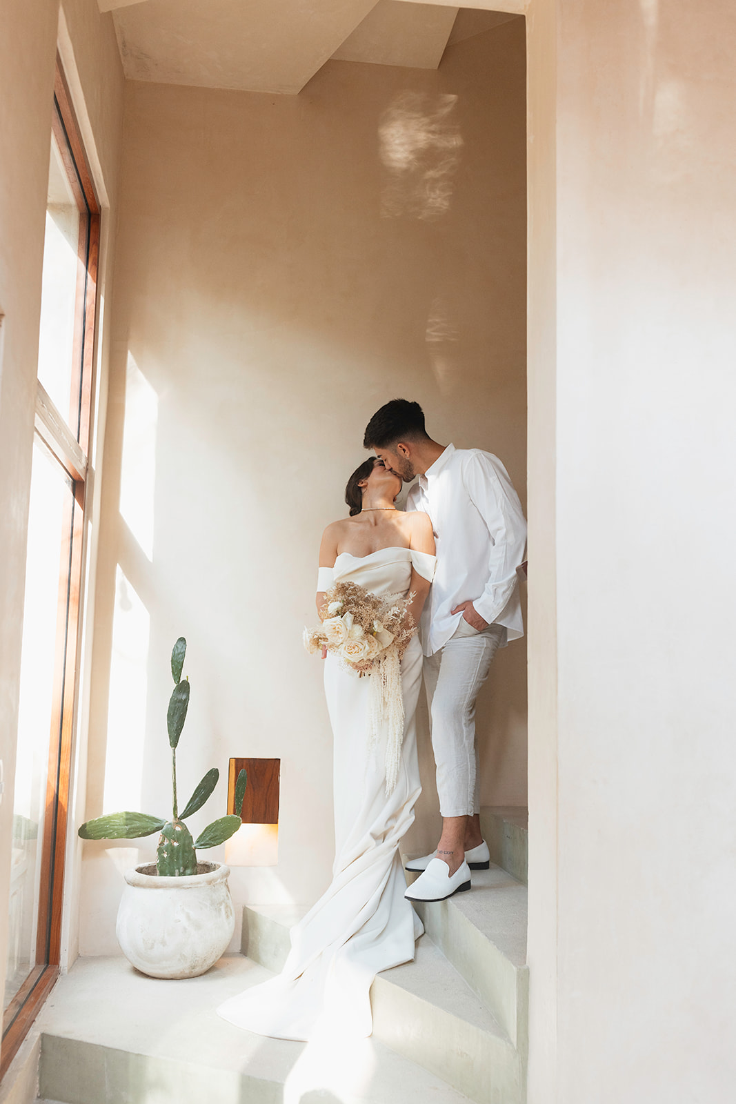 beautiful couple pose together in a tropical destination 