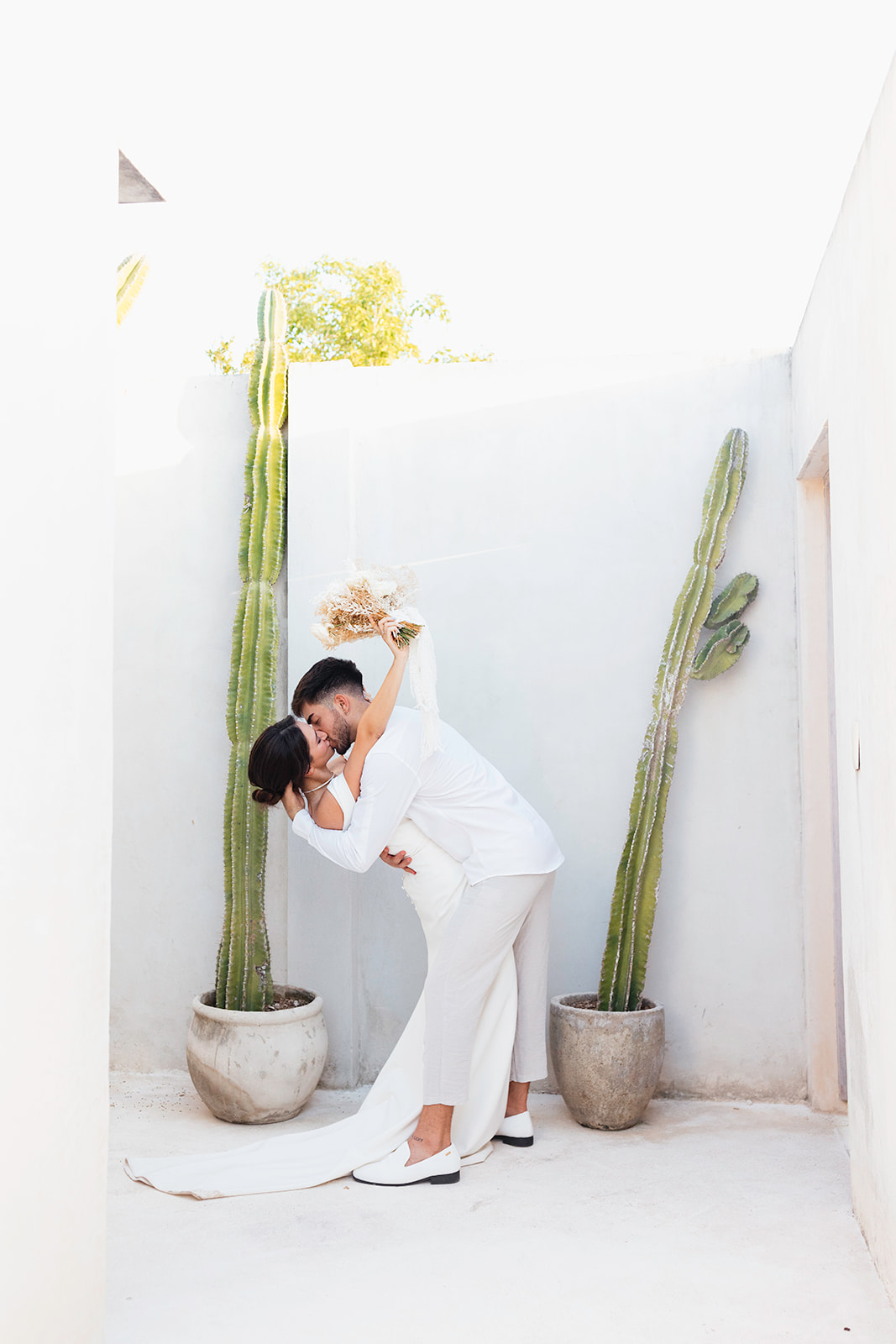 beautiful couple pose together in a tropical destination 