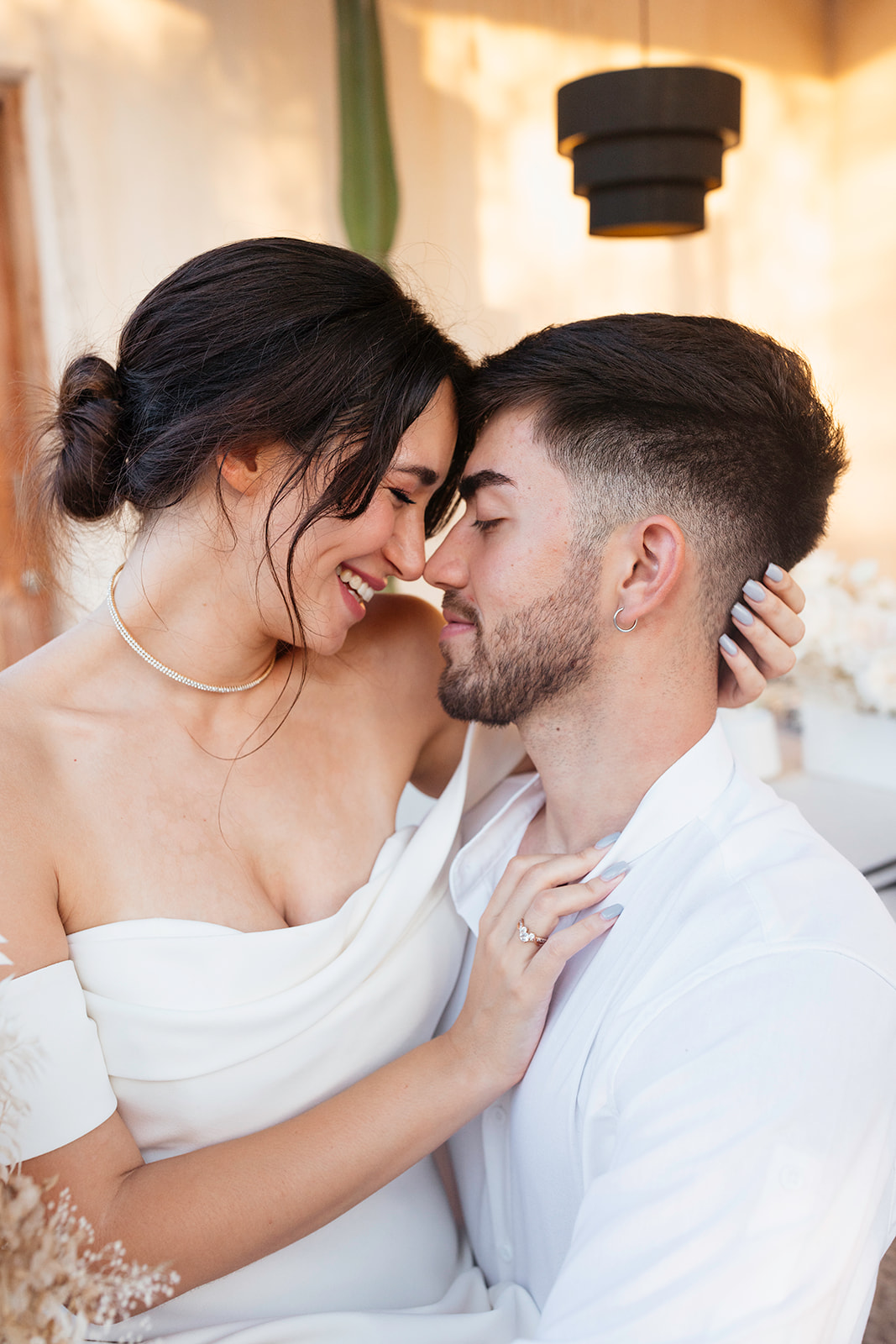 beautiful couple pose together in a tropical destination 